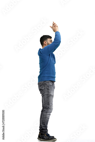 A man, full-length, on a white background, claps