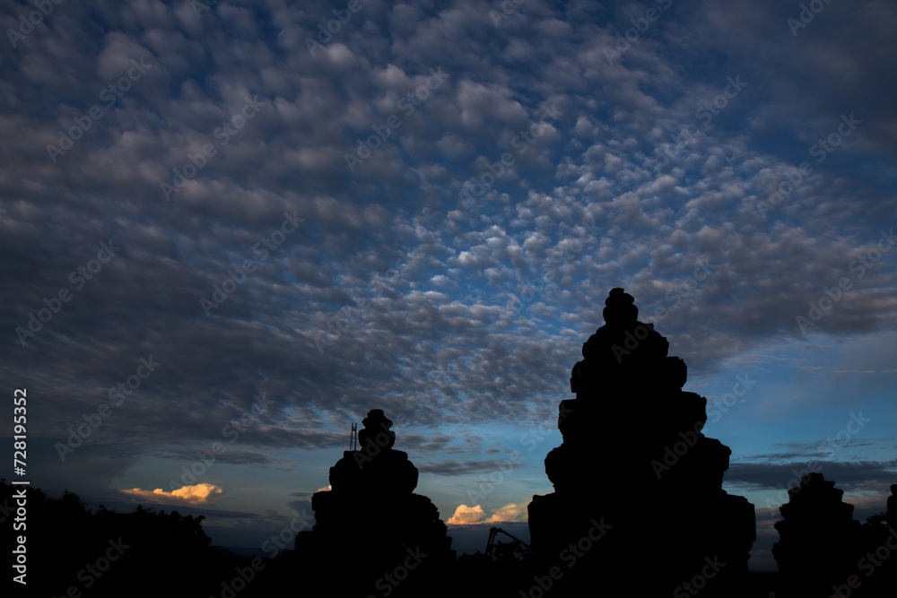 Panoramic cloudscape with the sun rays radiating from behind the cloud.Phnom Bakheng sunset view Angkor Wat, Siem Reap, Cambodia