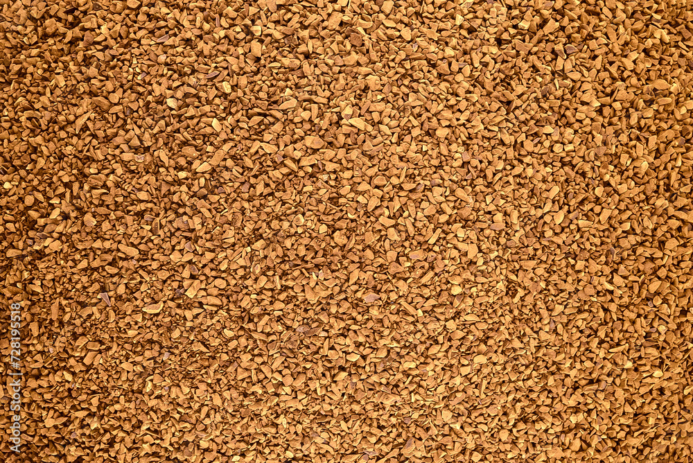 Instant sublimated coffee with a golden hue, background for design Instant sublimated coffee with a golden hue, background for design