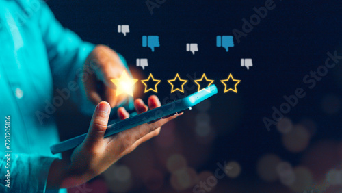 Businessmen chose a 1-star rating review in the survey on the virtual touch screen on smartphones. Bad review, bad service dislike bad quality, low rating, social media not good
