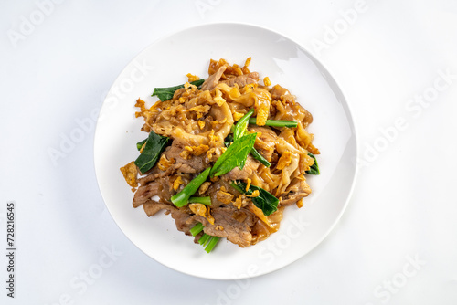 stir fried large noodles with soy sauce, dish of PAD SEE EW