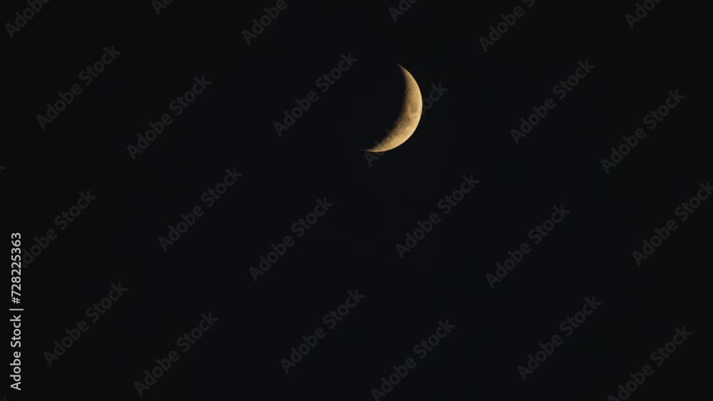 A Wide Dramatic Night Time Closeup Shot Of A Crescent Moon With Orange Hue (From Top To Bottom Of Frame) A Wide Dramatic Night Time Closeup Shot Of A Crescent Moon With Orange Hue (From Top To Bottom Of Frame)