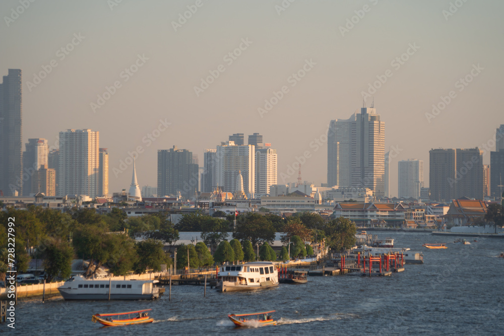 Aerial view of Bangkok Downtown Skyline with Chao Phraya River, Thailand. Financial district and business centers in smart urban city in Asia. Skyscraper and high-rise buildings.