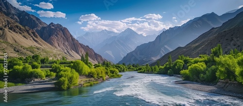 Captivatingly Beautiful River Reveals Flaws Amidst Majestic Fann Mountains photo