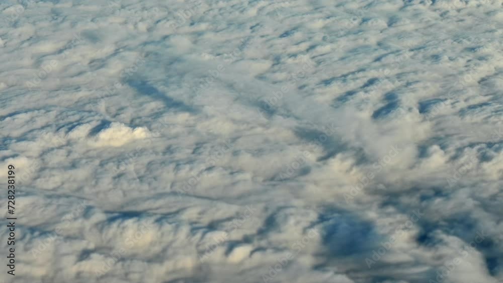 Valley Veiled: Aerial View of BC Cascade Valley Blanketed by Clouds, Filmed from an Airplane on a Sunny Partly Cloudy Day Valley Veiled: Aerial View of BC Cascade Valley Blanketed by Clouds, Filmed from an Airplane on a Sunny Partly Cloudy Day