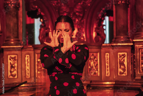 the girl dances flamenco passionately on a hot summer night