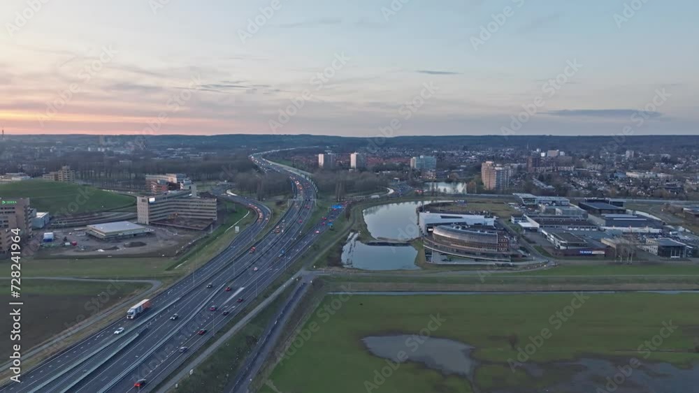 Flyover the roundabout near Arnhem with load of cars passing by below. The round about Velperbroek is a busy traffic node in the Netherlands Flyover the roundabout near Arnhem with load of cars passing by below. The round about Velperbroek is a busy traffic node in the Netherlands