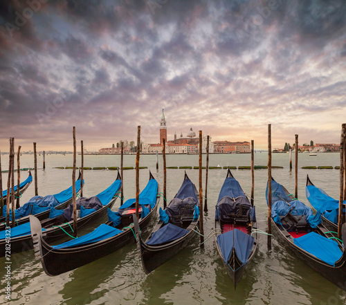 Gondolas moored in St. Mark's Square with the Church of San Giorgio di Maggiore in the background - Venice, Venice, Italy, © Andrey