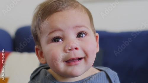 Baby boy with bookers in his nose photo