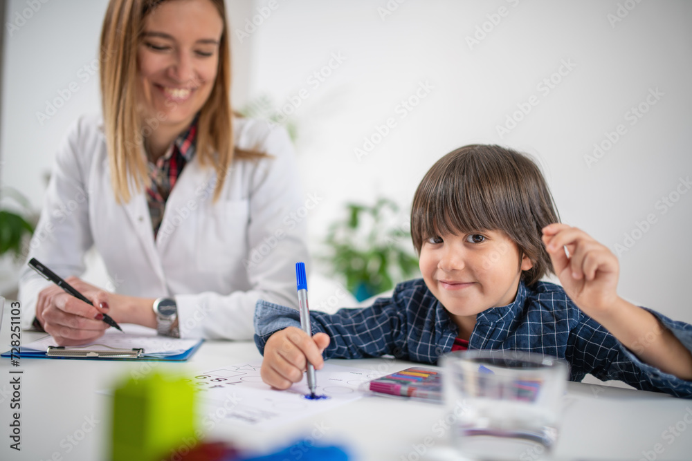 Toddler in a psychology test through coloring shapes, fostering early cognitive development with vibrant educational activities Toddler in a psychology test through coloring shapes, fostering early cognitive development with vibrant educational activities
