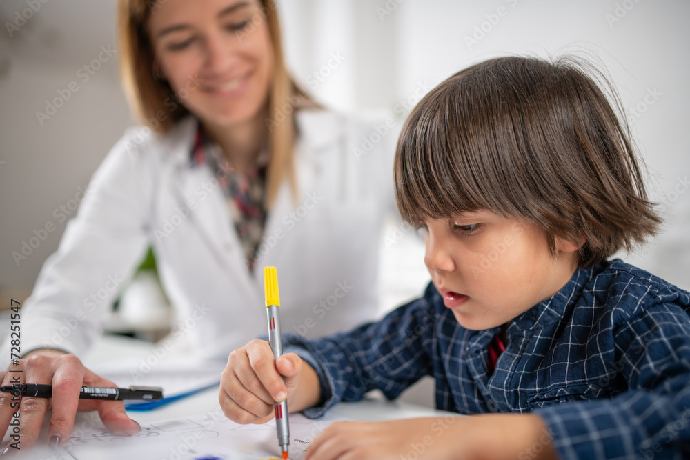 Early cognitive development as toddler engage in a psychology test through coloring various shapes, a playful approach to understanding young minds Early cognitive development as toddler engage in a psychology test through coloring various shapes, a playful approach to understanding young minds