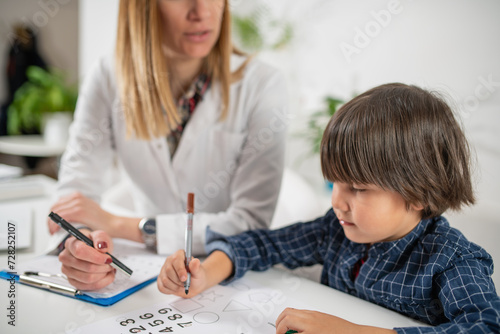 Young mind at work as a toddler engages in a captivating psychology test, showcasing their logical abilities with numbers and fostering early cognitive development