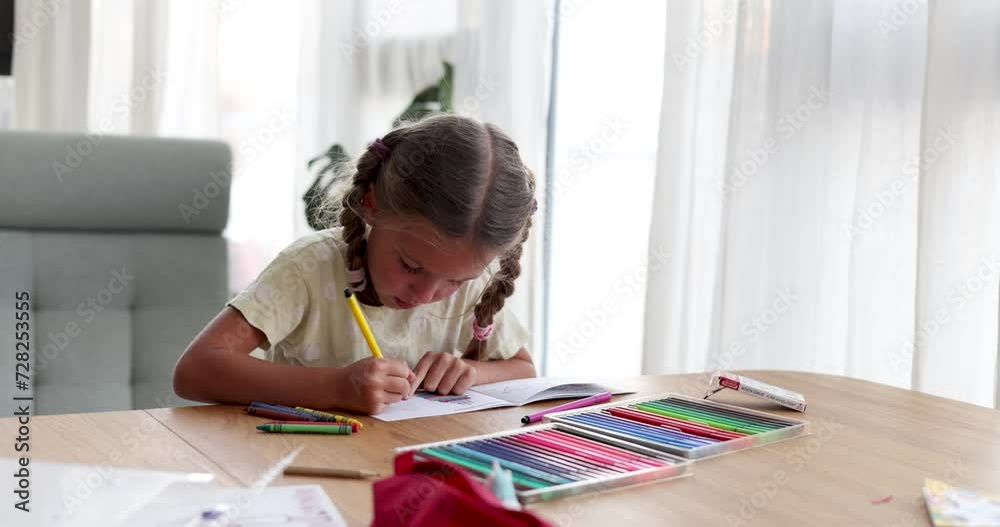 Little girl with braids chooses bright felt-tip pen to draw picture. Hobby and creative personality. Focused child drawing in calm atmosphere Little girl with braids chooses bright felt-tip pen to draw picture. Hobby and creative personality. Focused child drawing in calm atmosphere