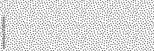 Seamless vector hand drawn irregular tiny polka dot pattern. Small size randomly scattered dots texture. Dotted cute pattern. Black on white artistic doodle sketch tiny dots seamless surface design photo