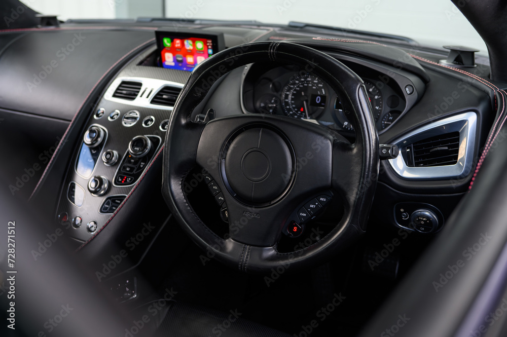 Luxury sports car steering wheel leather interior