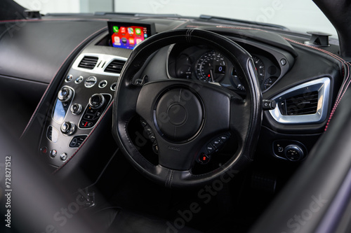 Luxury sports car steering wheel leather interior © Harry