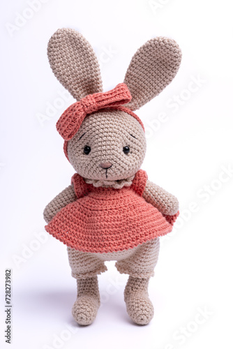 Handmade crocheted bunny toy, amigurumi, isolated. © O.B.