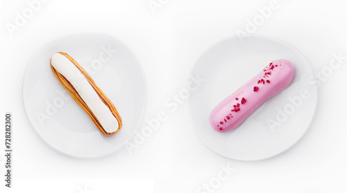 Eclairs dessert with white and pink icing on plate