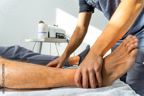 close up of a physiotherapist placing the feet of a patient
