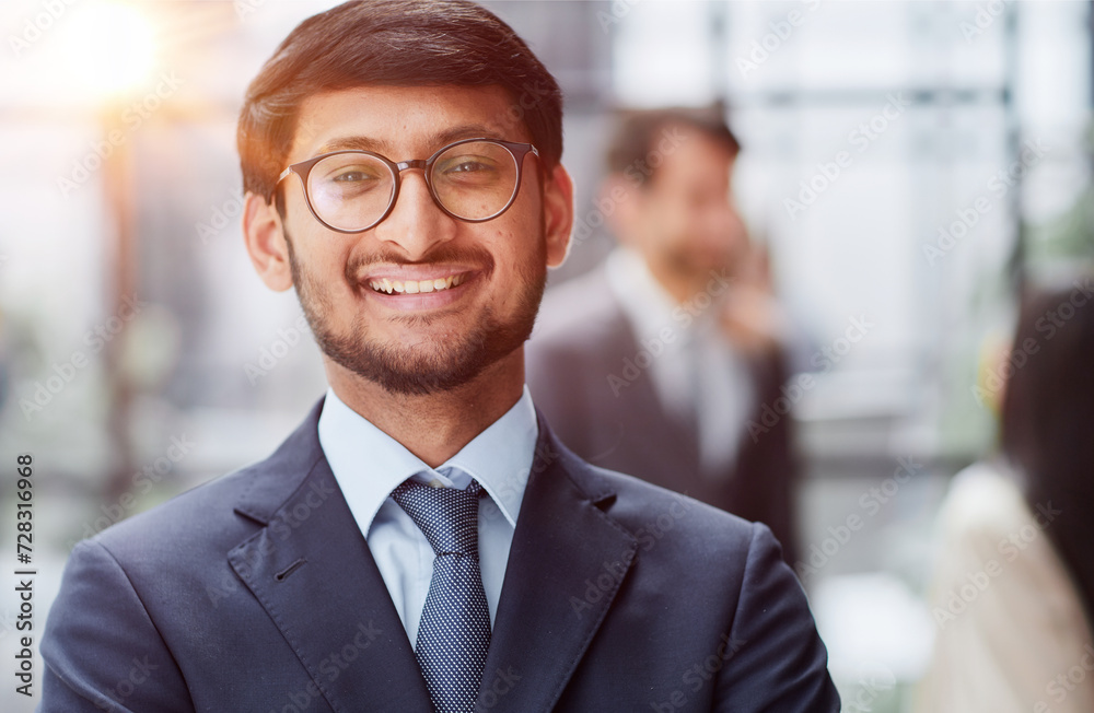 Fototapeta premium Handsome young business man standing confident in the office