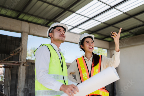 team engineer, foreman, architect meeting for colleagues discussing and checks construction blueprints at onsite