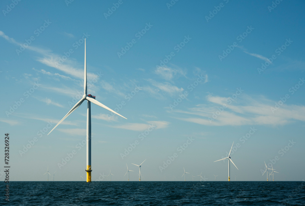 Netherlands, Zeeland, Domburg, Sky over offshore wind farm in North Sea Netherlands, Zeeland, Domburg, Sky over offshore wind farm in North Sea
