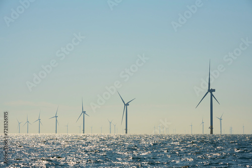Netherlands, Zeeland, Domburg, Sky over offshore wind farm in North Sea photo