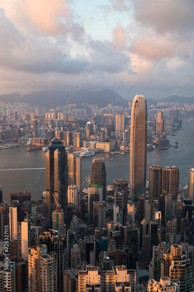 custom made wallpaper toronto digitalVictoria harbor near buildings in Hong Kong city under cloudy sky at sunset