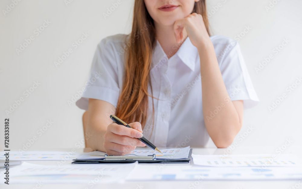 Caucasian businesswoman management work plan strategies to increase business income. Have a finance graph analysis of the new target success