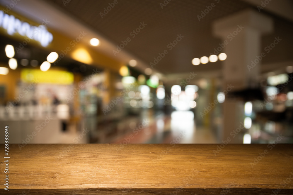 dark blurred background with empty table top, cafe restaurant windows. background for your product. High quality photo