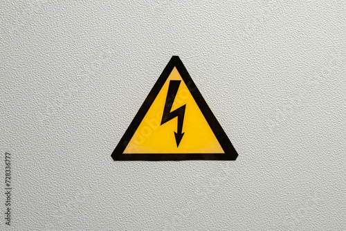 Triangular danger sign (black lightning on yellow background)