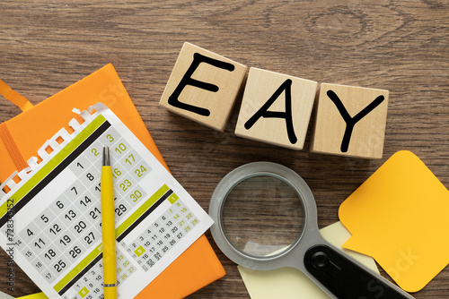 EAY Effective Annual Yield -wooden blocks near notepad and calendar photo