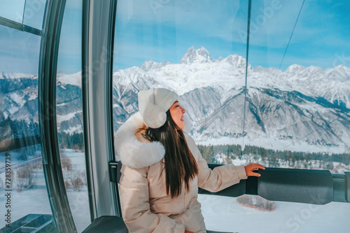 Hatsvali sky, cable car ride up the winter snowy mountain on the northern peak of Mestai in Georgia. photo