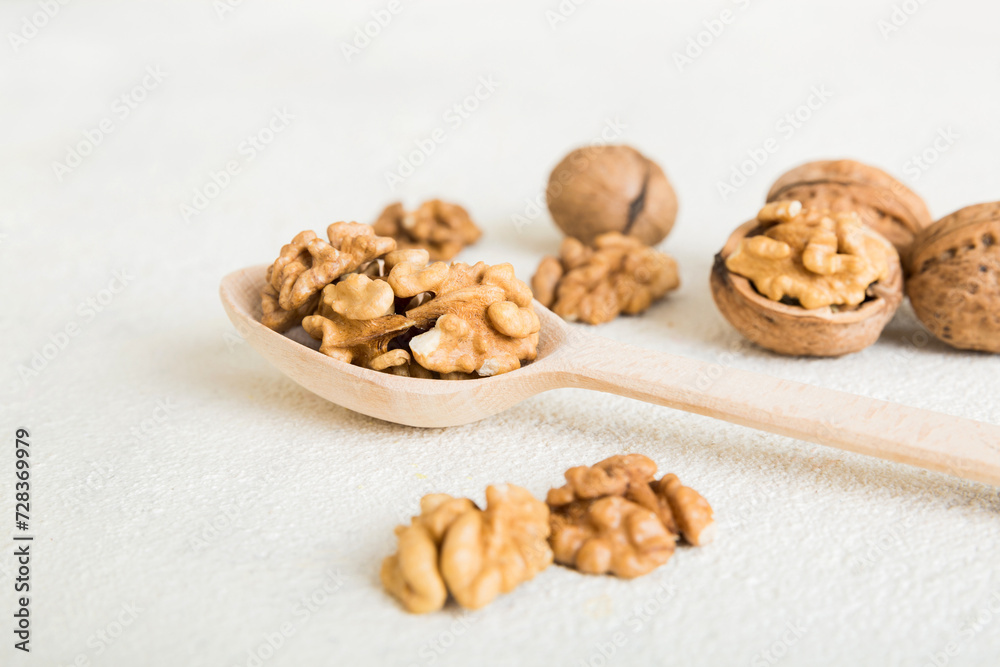 Fresh healthy walnuts in bowl on colored table background. Top view Healthy eating bertholletia concept. Super foods Fresh healthy walnuts in bowl on colored table background. Top view Healthy eating bertholletia concept. Super foods