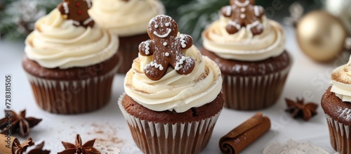 Gingerbread cupcakes topped with eggnog buttercream and a gingerbread man.