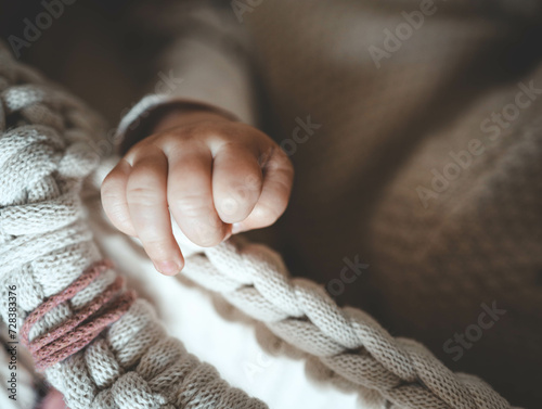 Hand of a newborn baby close-up, concept of happy motherhood