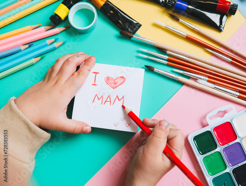 Text words I love mama on sheet of paper. Happy mothers day concept