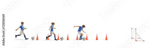 Boys training football with cone obstacles, aguility and speed training