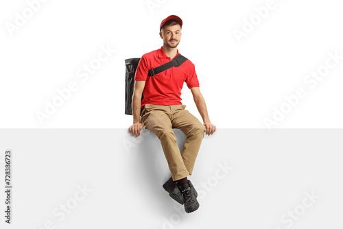 Food delivery guy with a bag sitting on a blank panel