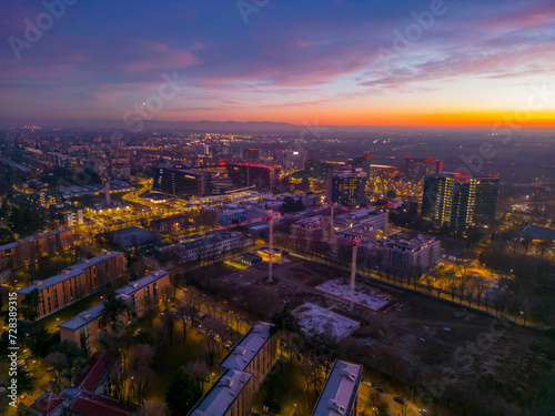 Beautiful pink sunset over the city of San Donato Milanese photo from a drone. Cityscape from drone. Italy, Lombardy, Milan, San Donato Milanese.
