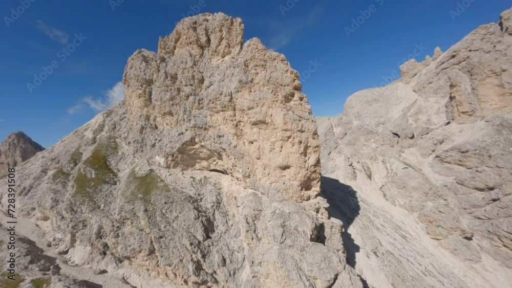 FPV drone rising up Italian Dolomite mountain range preparing to dive breath taking rocky ridge FPV drone rising up Italian Dolomite mountain range preparing to dive breath taking rocky ridge