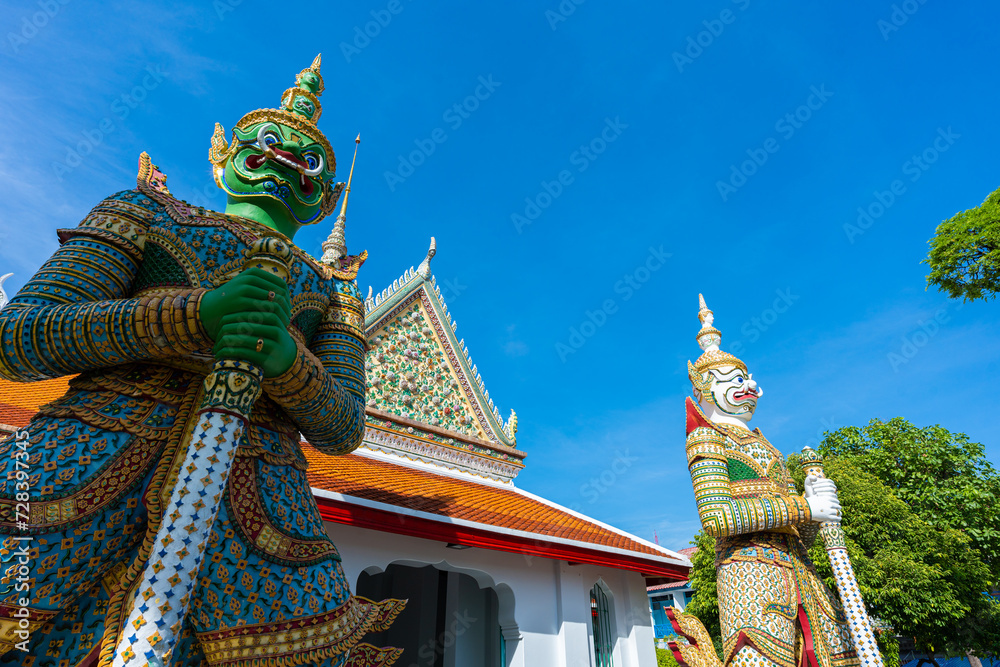 Fototapeta premium Statues of Giants in gate of temple demon guardians at Wat Arun