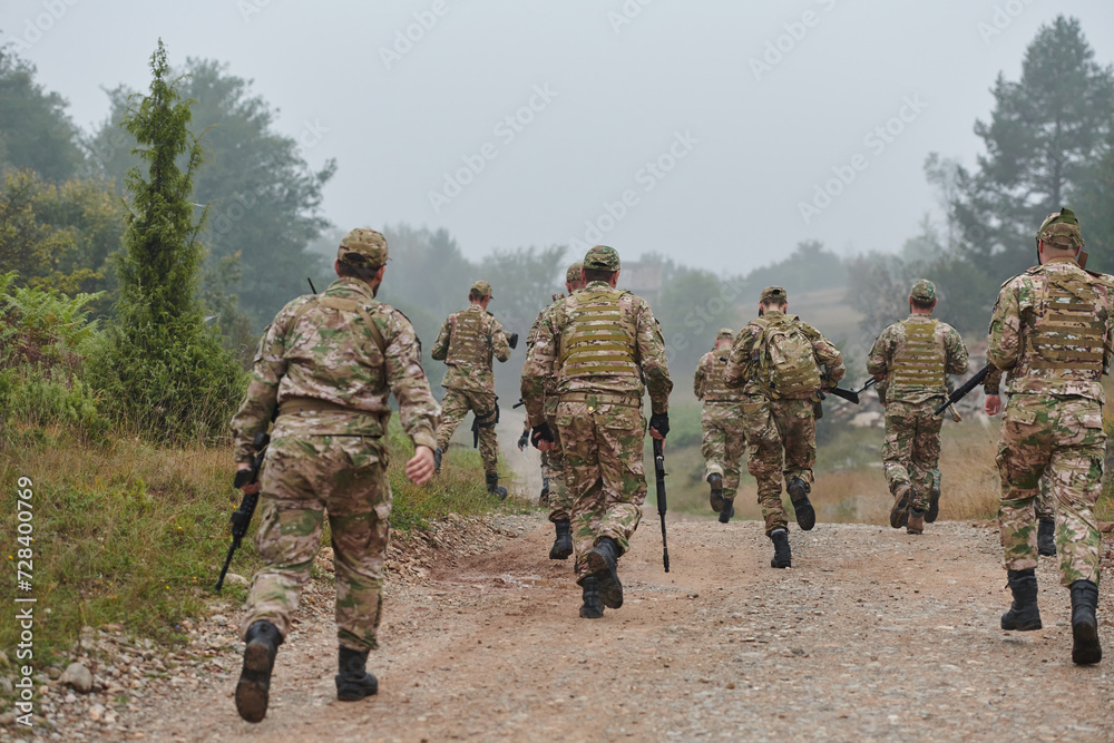 A disciplined and specialized military unit, donned in camouflage, strategically patrolling and maintaining control in a high-stakes environment, showcasing their precision, unity, and readiness for A disciplined and specialized military unit, donned in camouflage, strategically patrolling and maintaining control in a high-stakes environment, showcasing their precision, unity, and readiness for