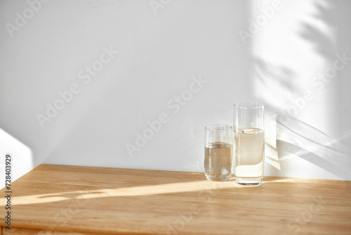 Wallpaper Mural A water cup and shadow on a table in the sunlight. Torontodigital.ca