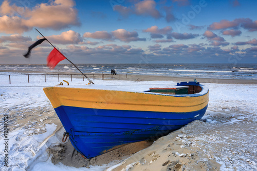 Fishing boats on the Baltic Sea beach in Jantar at winter. Poland