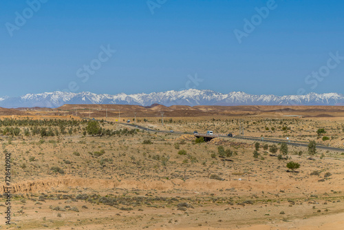 Moroccan desert road in Ouarzazate province. Road curve.