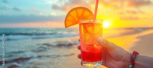 Savoring a tequila sunrise on a paradise beach on a sunny summer day with space for text placement
