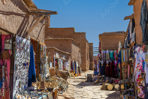 Souvenir shop with carpets, traditional clothes and other things in clay town of Ait Ben Haddou, Morocco. photo