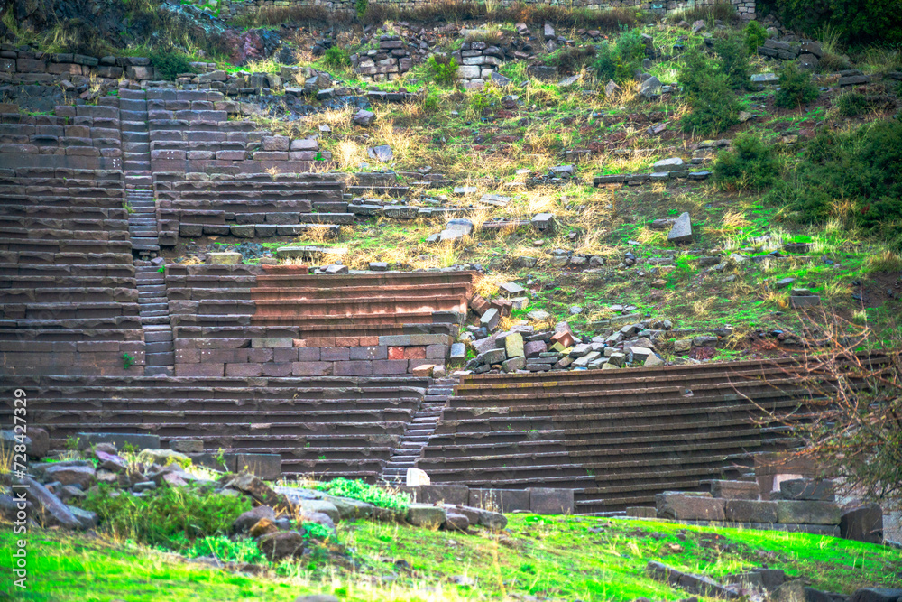 Rows of historic stone seats in the amphitheater, offering a closeup view of the tiered arrangement and the ancient allure where audiences once enjoyed grand spectacles Rows of historic stone seats in the amphitheater, offering a closeup view of the tiered arrangement and the ancient allure where audiences once enjoyed grand spectacles