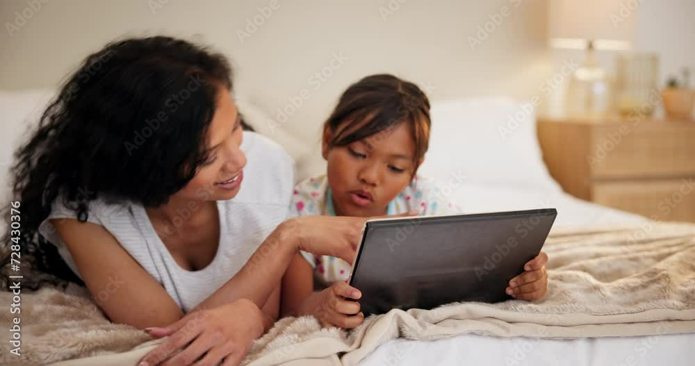 Family, bedroom and mother with girl, tablet and typing with a smile and cartoon with storytelling on a weekend break. Love, home or mama with daughter and tech with child development, joy or app Family, bedroom and mother with girl, tablet and typing with a smile and cartoon with storytelling on a weekend break. Love, home or mama with daughter and tech with child development, joy or app